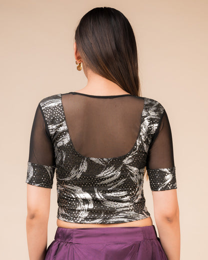 Rear view of the black metallic net stretchable blouse showcasing the deep round back design.

