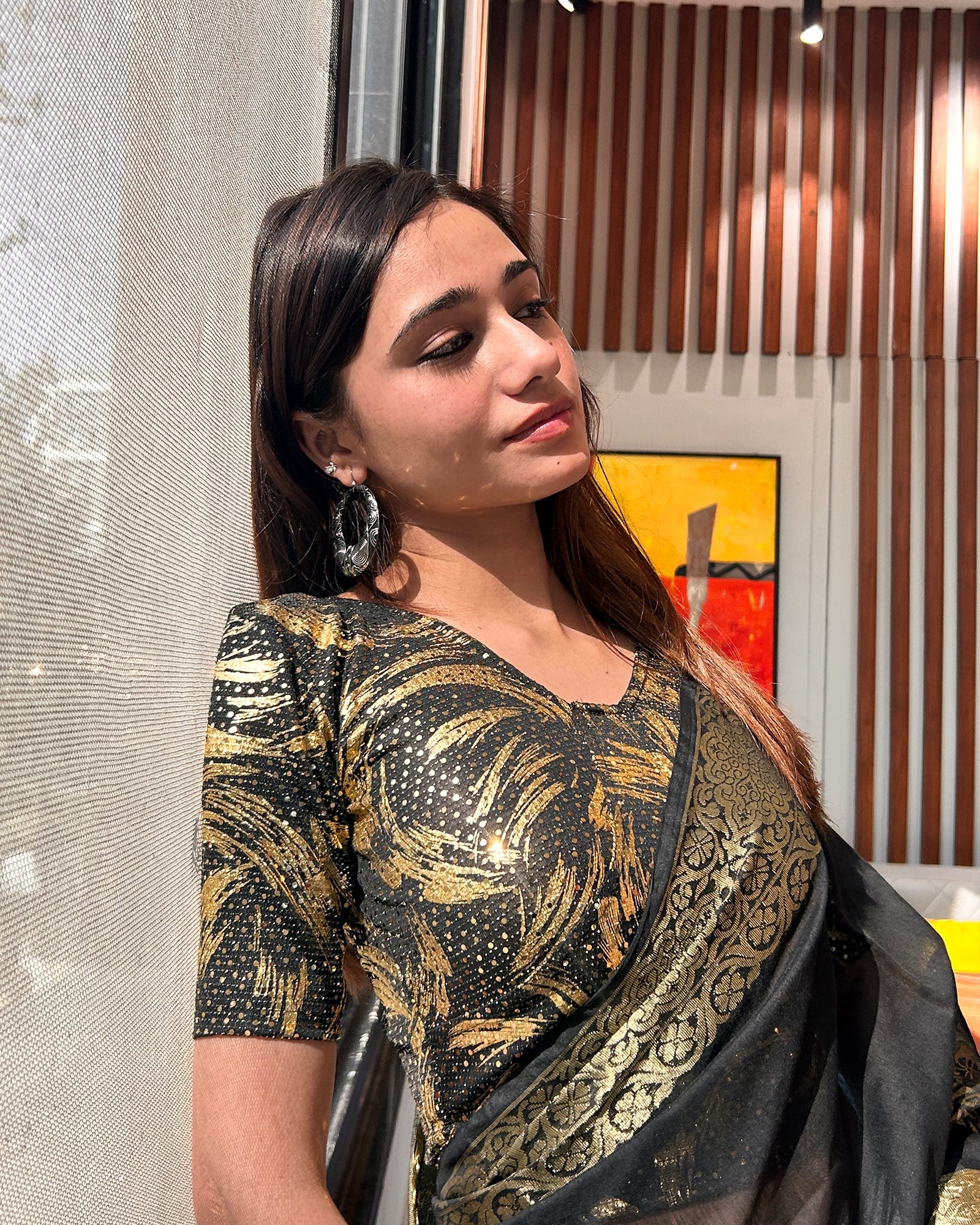 Model pairing the black sequin stretchable blouse with a traditional saree, demonstrating a complete festive look.