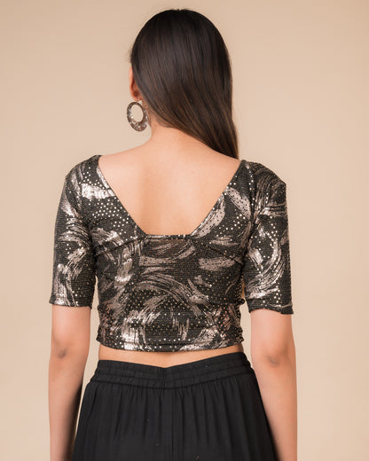 Rear view of the black sequin stretchable blouse showcasing the deep round back design.