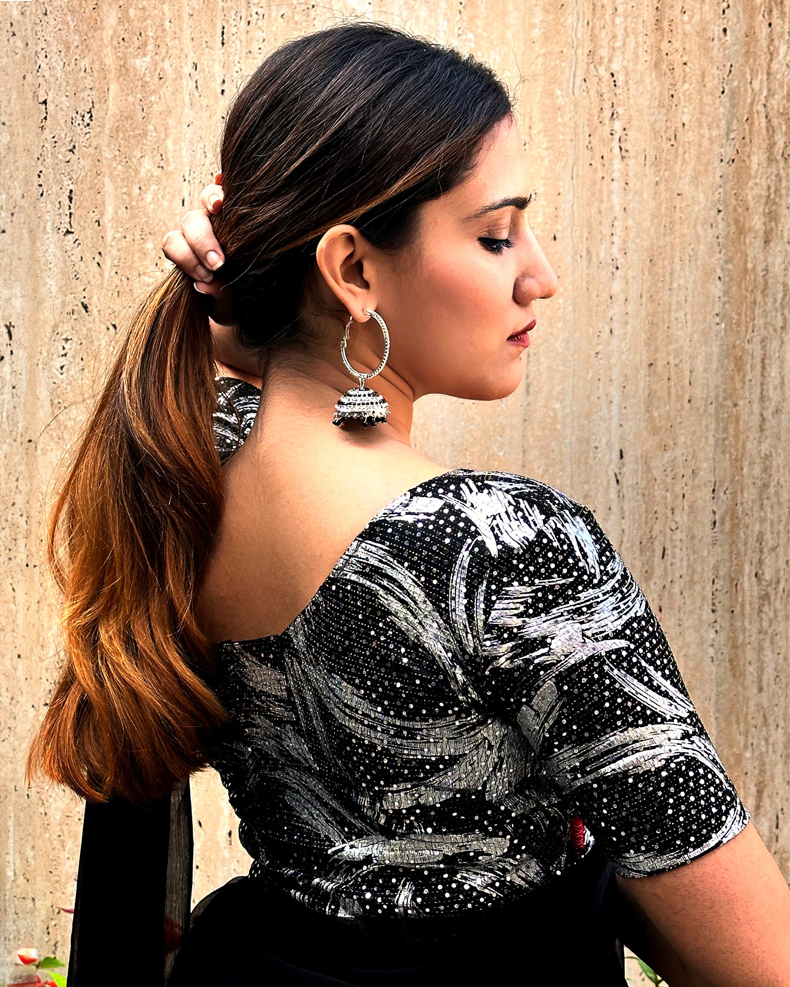 Model pairing the black sequin stretchable blouse with a traditional saree, demonstrating a complete festive look.