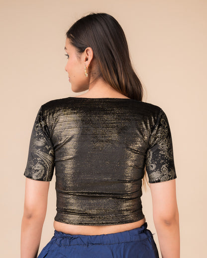 Rear view of the black-colored velvet embellished stretchable choli-style blouse showcasing the deep round back design.