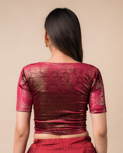 Rear view of the maroon-colored velvet embellished stretchable choli-style blouse showcasing the deep round back design.