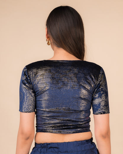 Rear view of the navy-colored velvet embellished stretchable choli-style blouse showcasing the deep round back design.