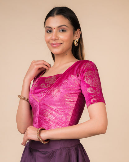 Side profile of the wine-colored velvet embellished stretchable choli-style blouse highlighting the fit and sleeve length.
