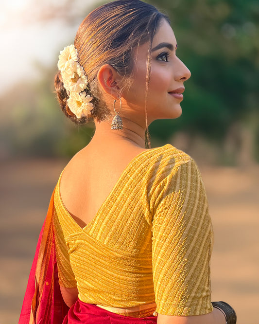 Model pairing the beige gold zari stretchable blouse with a traditional saree, demonstrating a complete ethnic look.
