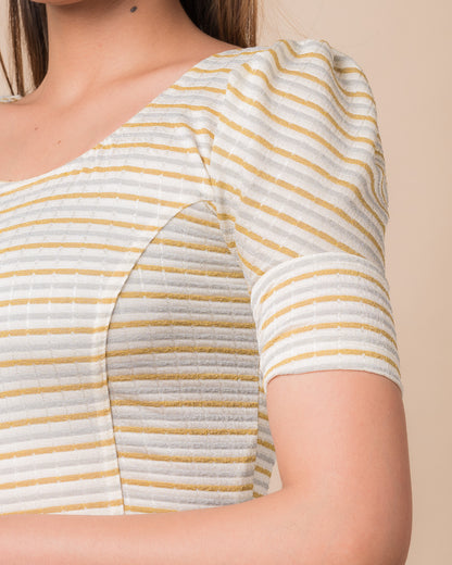 Close-up of the zari single-stripe fabric detailing the texture and stretchability of the readymade blouse.

