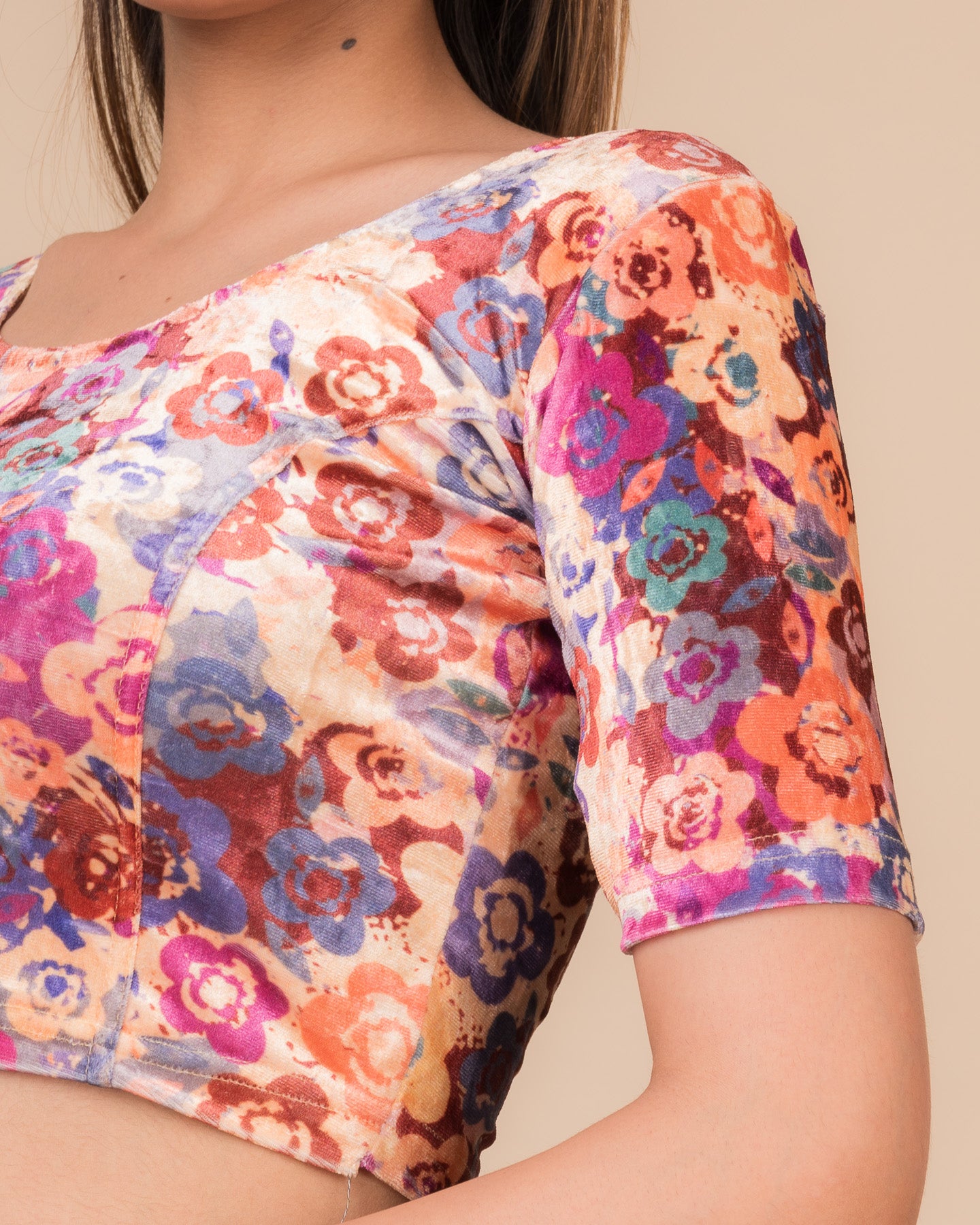  Close-up of the floral velvet fabric detailing the texture and stretchability of the readymade blouse.