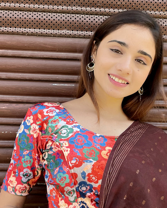 Model pairing the floral velvet stretchable blouse with a traditional saree, demonstrating a complete ethnic look.