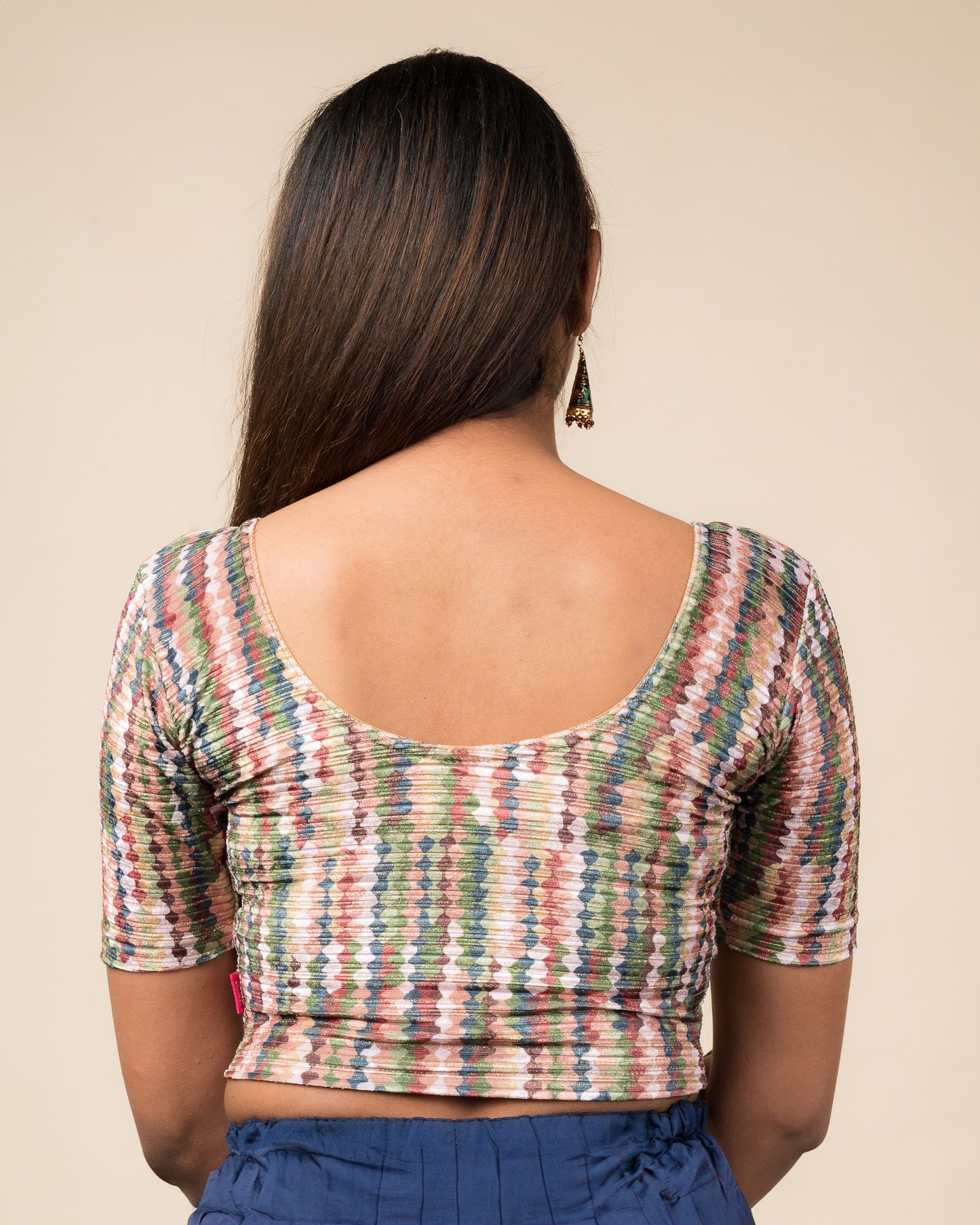 Rear view of the velvet stretchable blouse showcasing the back design and abstract pattern.