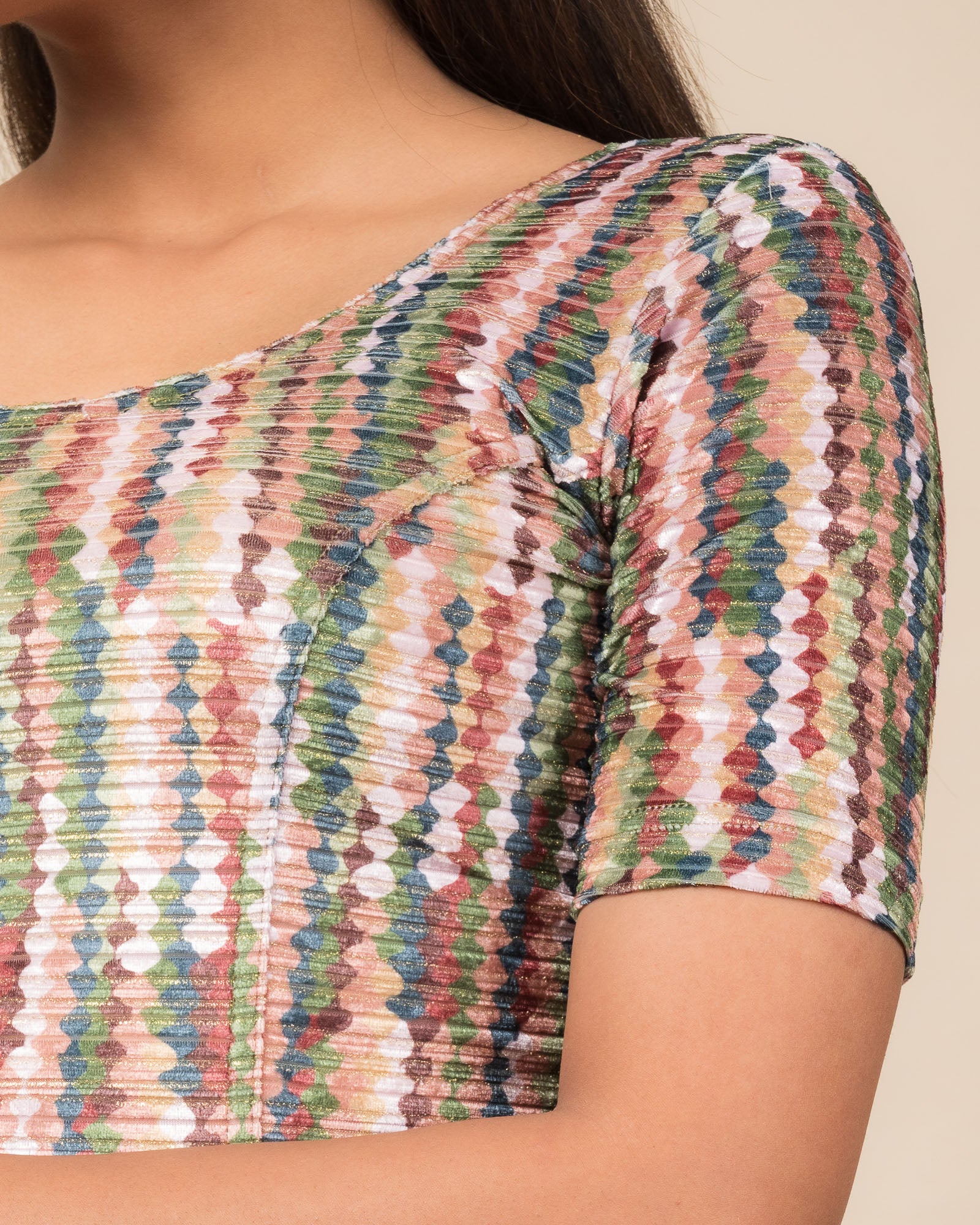 Close-up of the velvet fabric detailing the texture and abstract print of the readymade blouse.