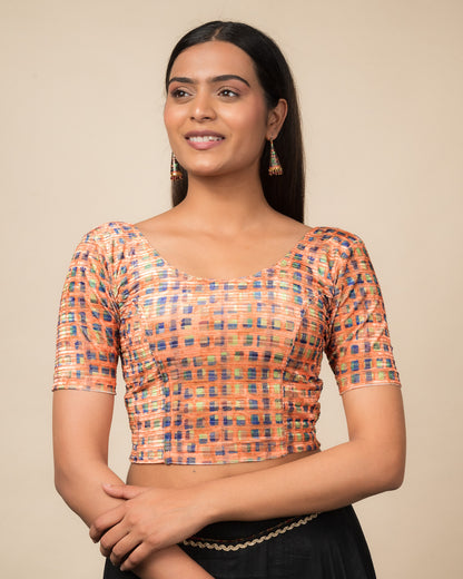 Model wearing a velvet stretchable readymade blouse with elbow sleeves and round neckline featuring modern abstract print.