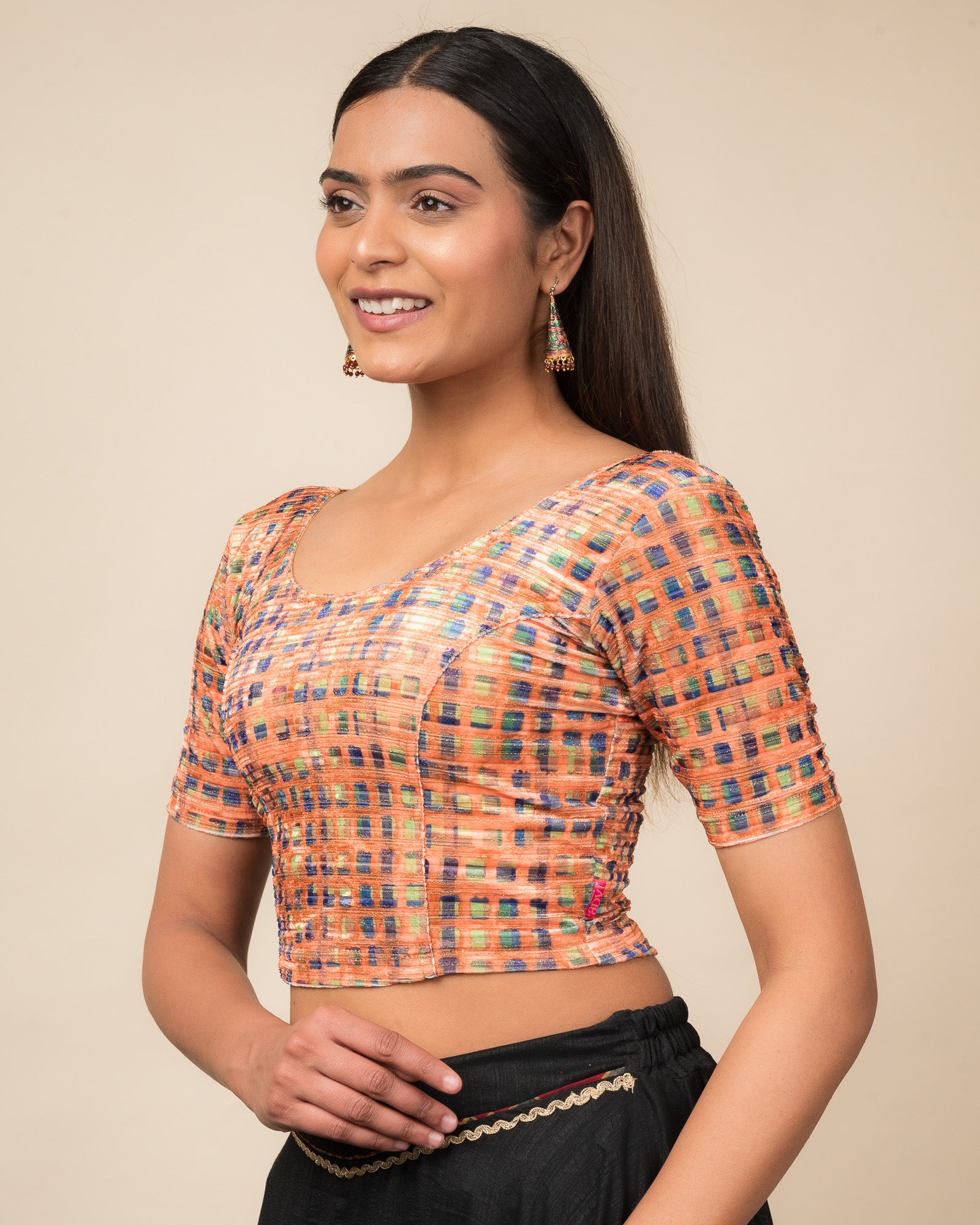 Side profile of the velvet stretchable blouse highlighting the fit and sleeve length.