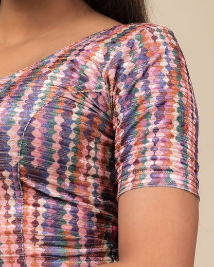  Close-up of the velvet fabric detailing the texture and abstract print of the readymade blouse.