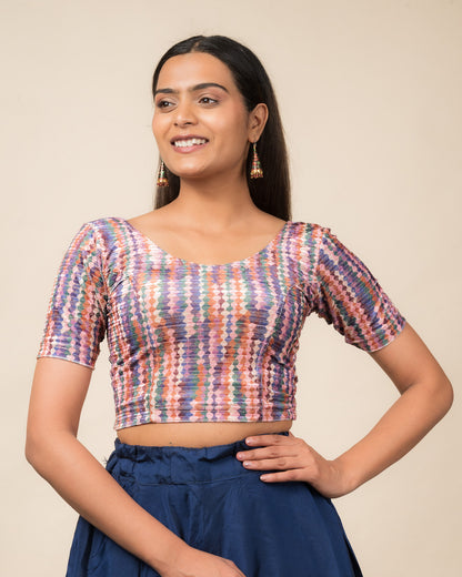 Model wearing a velvet stretchable readymade blouse with elbow sleeves and round neckline featuring modern abstract print.