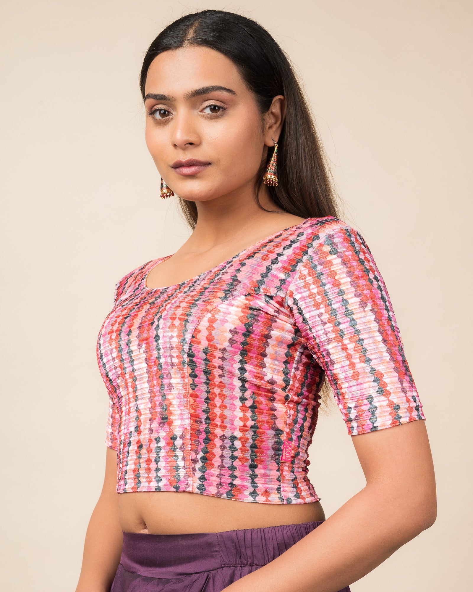 Side profile of the velvet stretchable blouse highlighting the fit and sleeve length
