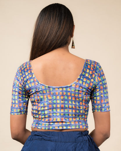 Rear view of the velvet stretchable blouse showcasing the back design and abstract pattern.
