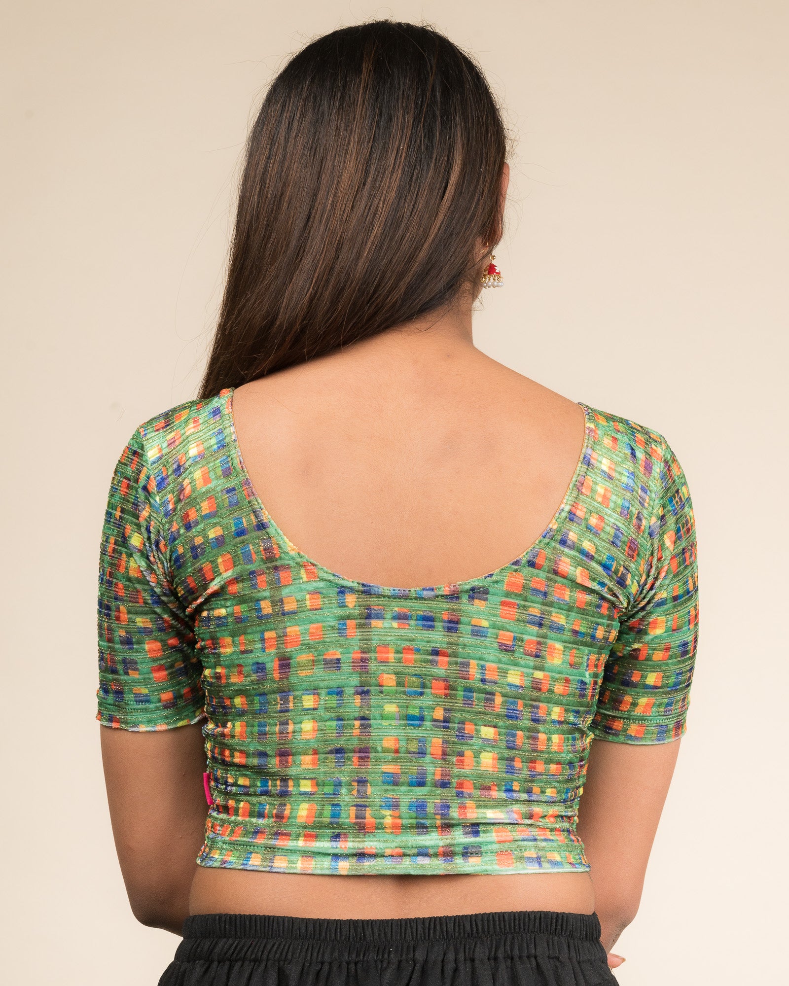 Rear view of the velvet stretchable blouse showcasing the back design and abstract pattern.