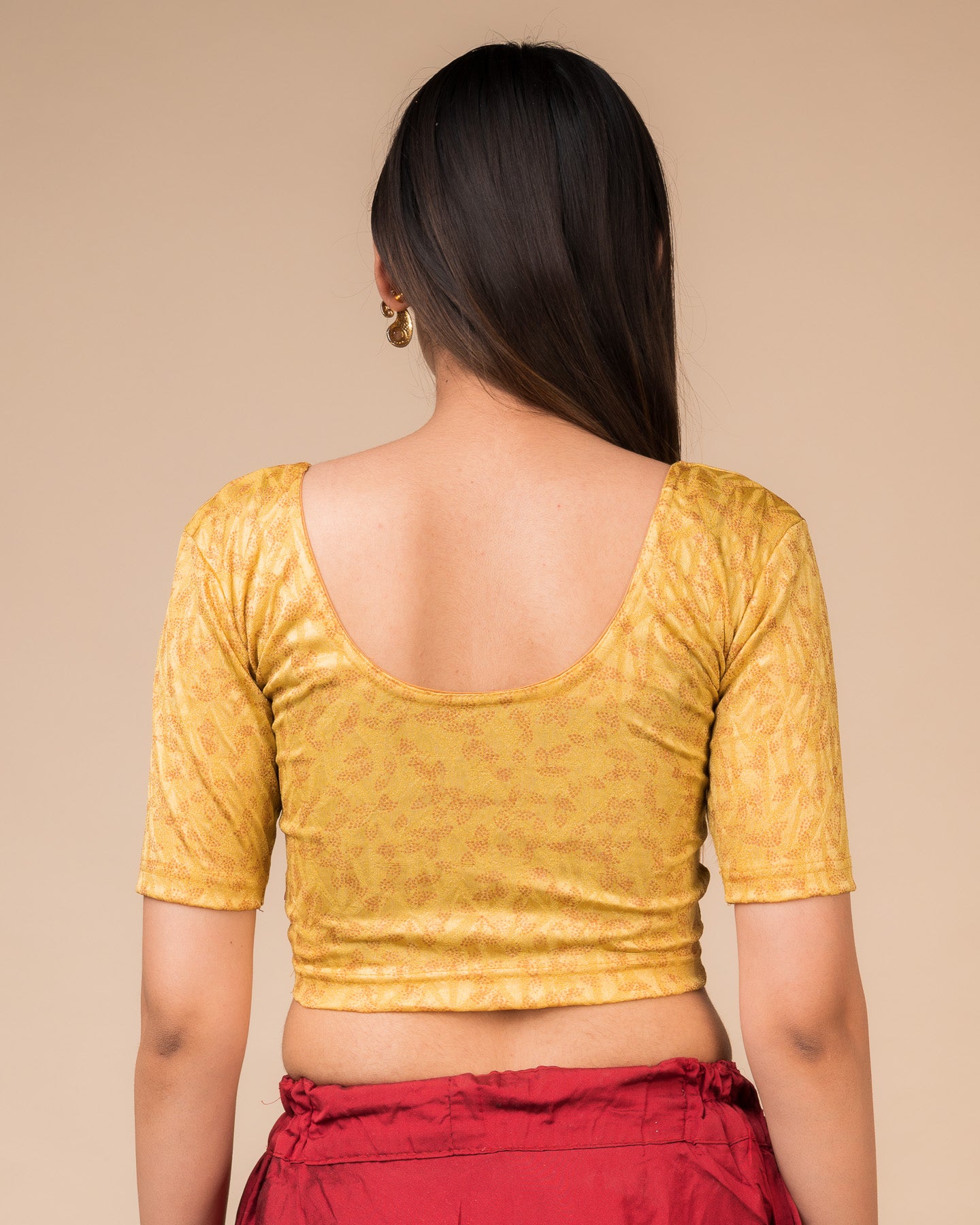 Rear view of the textured stretchable blouse showcasing the back design.
