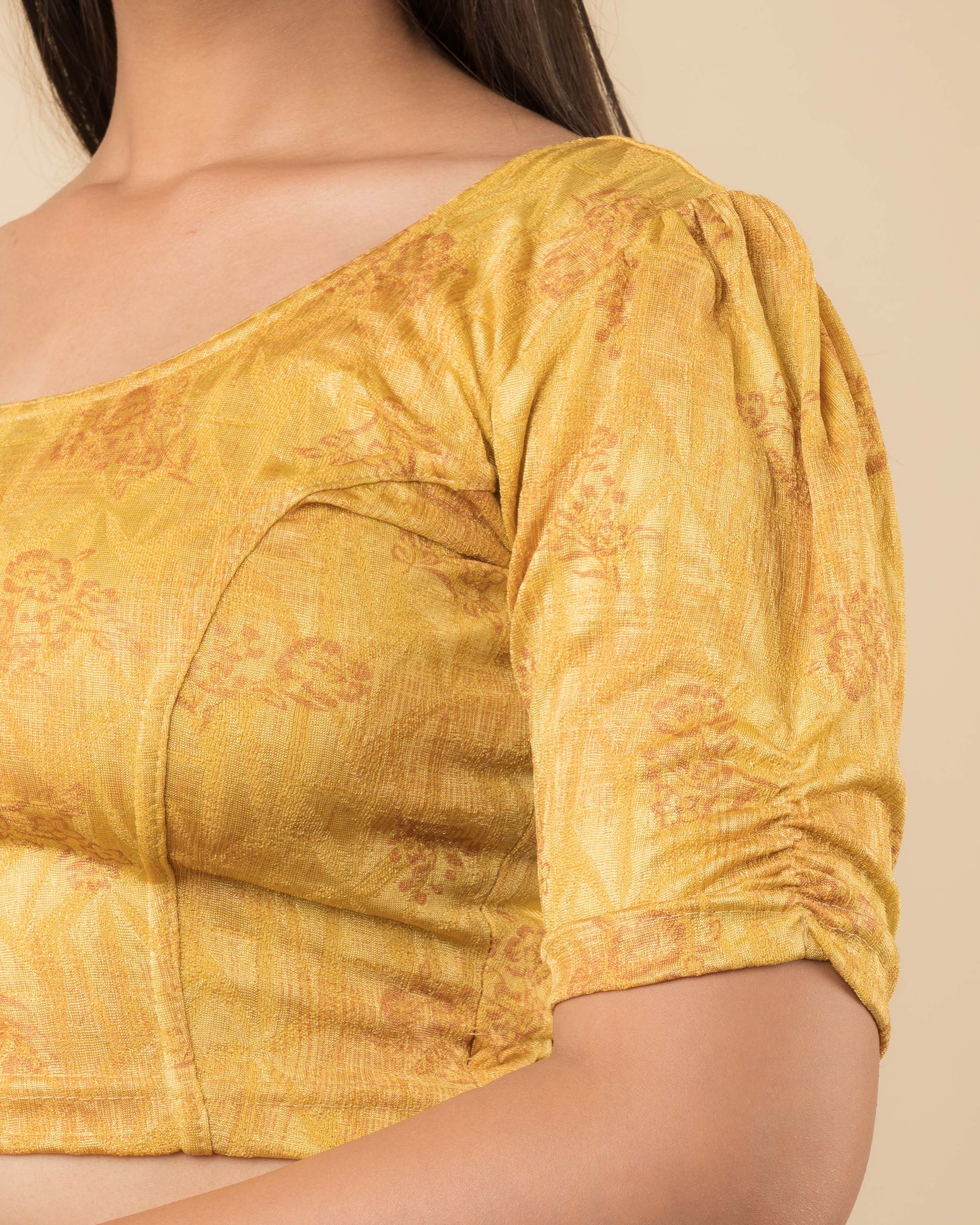Close-up of the jacquard fabric detailing the texture and embellishments of the readymade blouse.