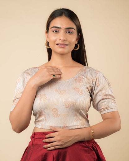 Model wearing a corset-style stretchable readymade blouse with puffed elbow sleeves and round neckline.
