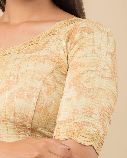 Close-up of the jacquard fabric detailing the texture and zari embroidery of the readymade blouse.