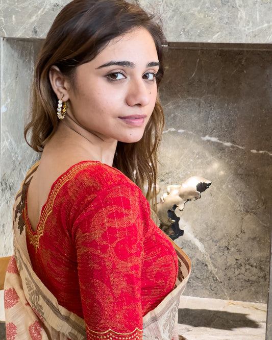 Model pairing the red-colored stretchable blouse with a traditional saree, demonstrating a complete ethnic look.