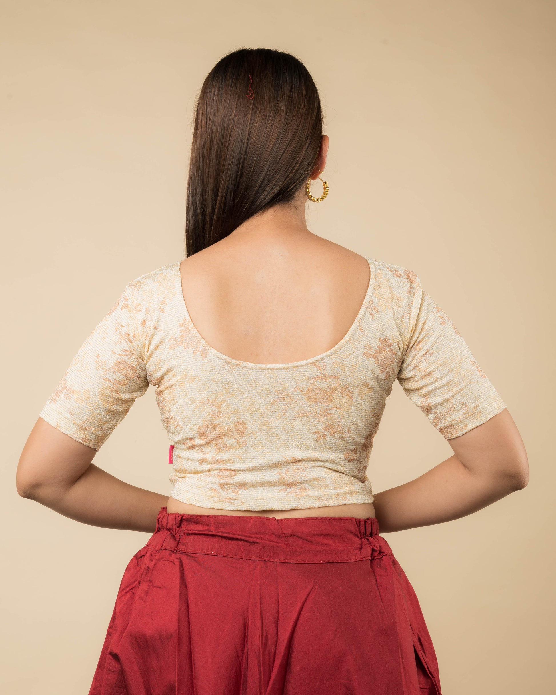 Rear view of the metallic floral stretchable blouse showcasing the back design.