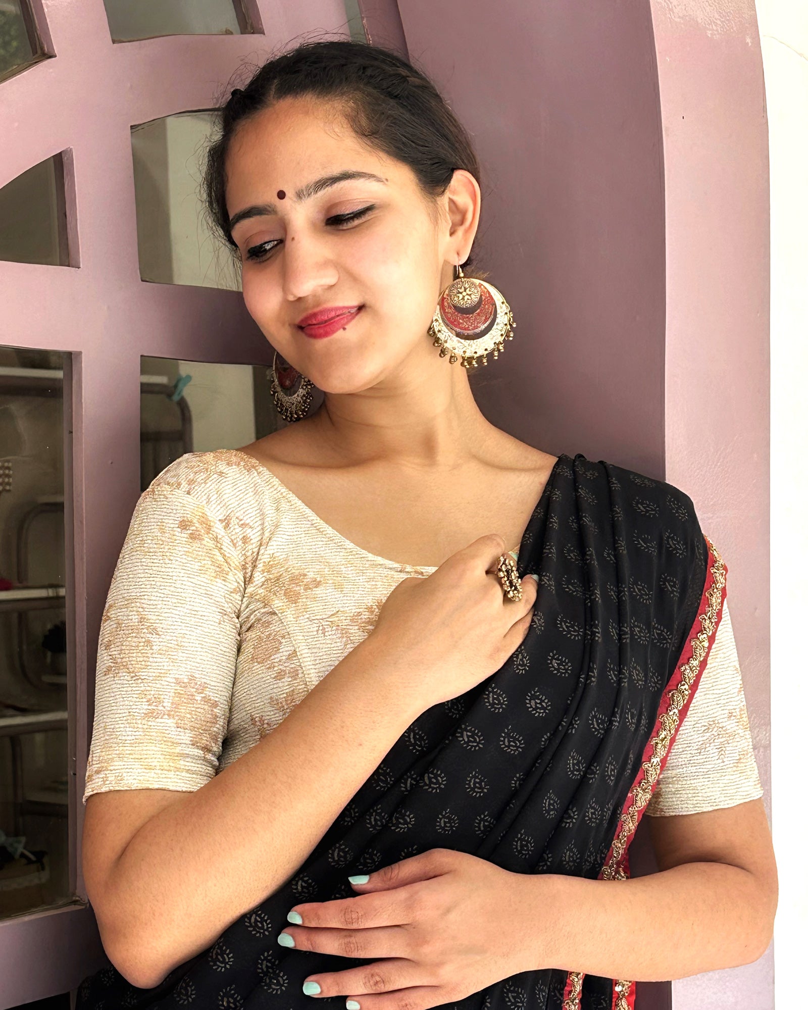 Model pairing the metallic floral stretchable blouse with a traditional saree, demonstrating a complete ethnic look.