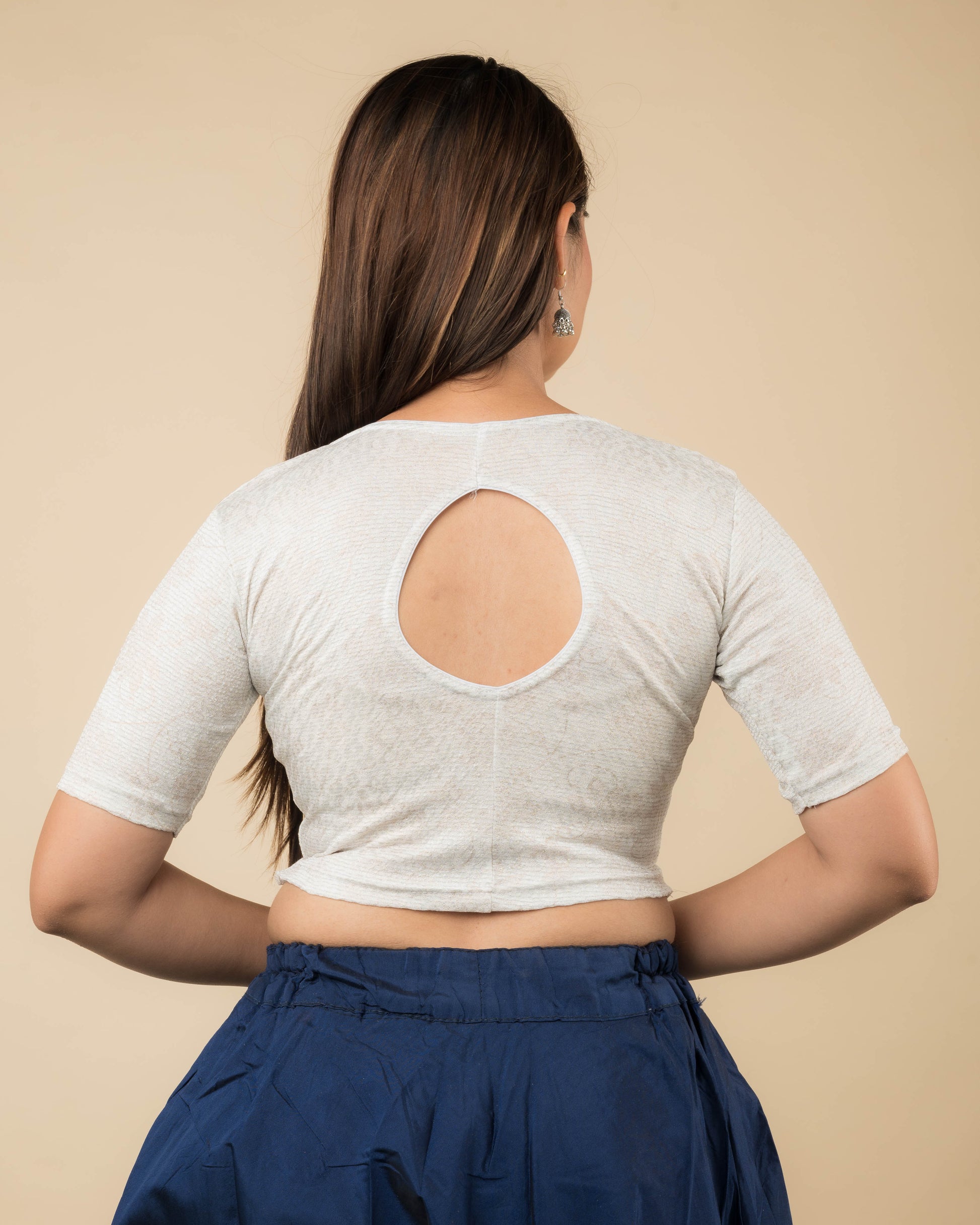 Rear view of the metallic floral stretchable blouse showcasing the back design.
