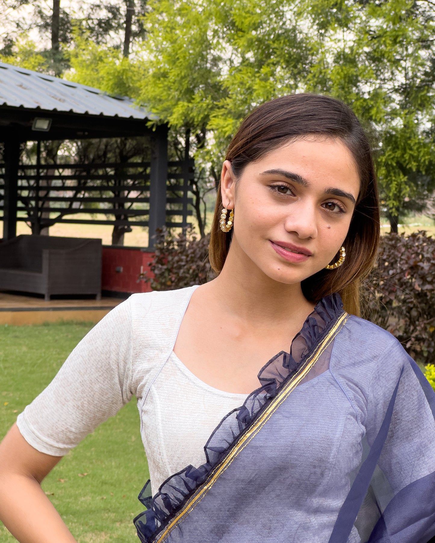 Model pairing the metallic floral stretchable blouse with a traditional saree, demonstrating a complete ethnic look.
