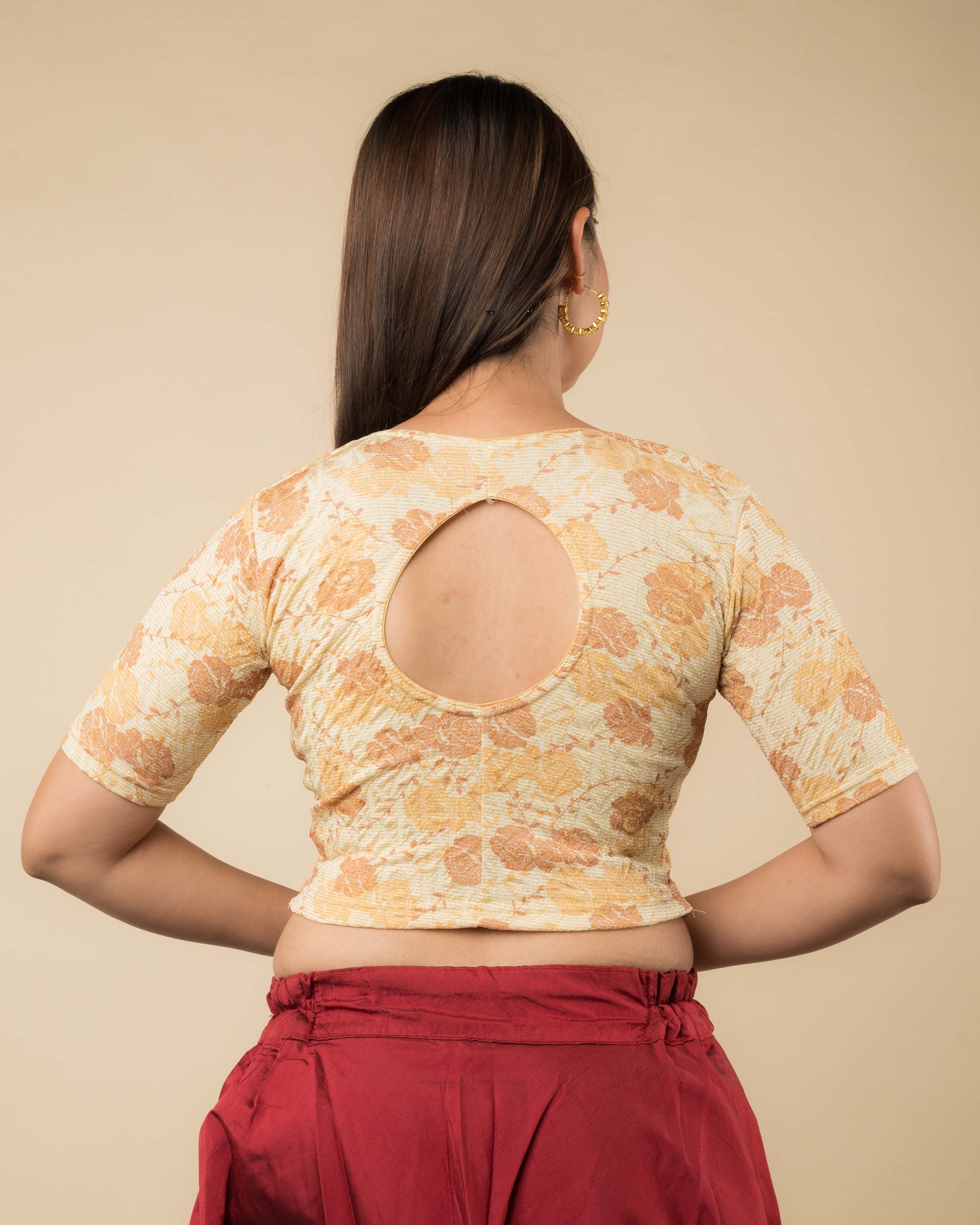 Rear view of the metallic floral stretchable blouse showcasing the peekaboo back design.