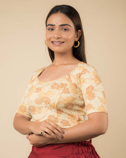 Side profile of the metallic floral stretchable blouse highlighting the fit and sleeve length.