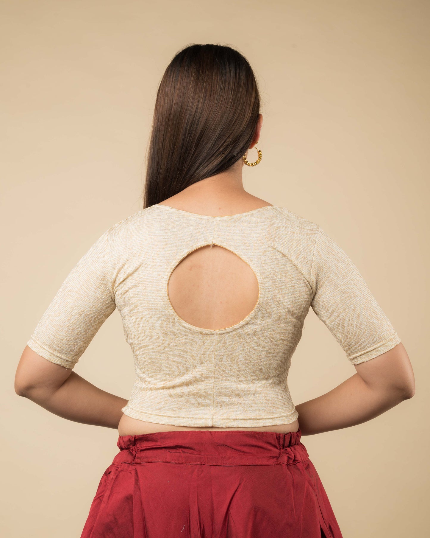 Rear view of the metallic floral stretchable blouse showcasing the back design.