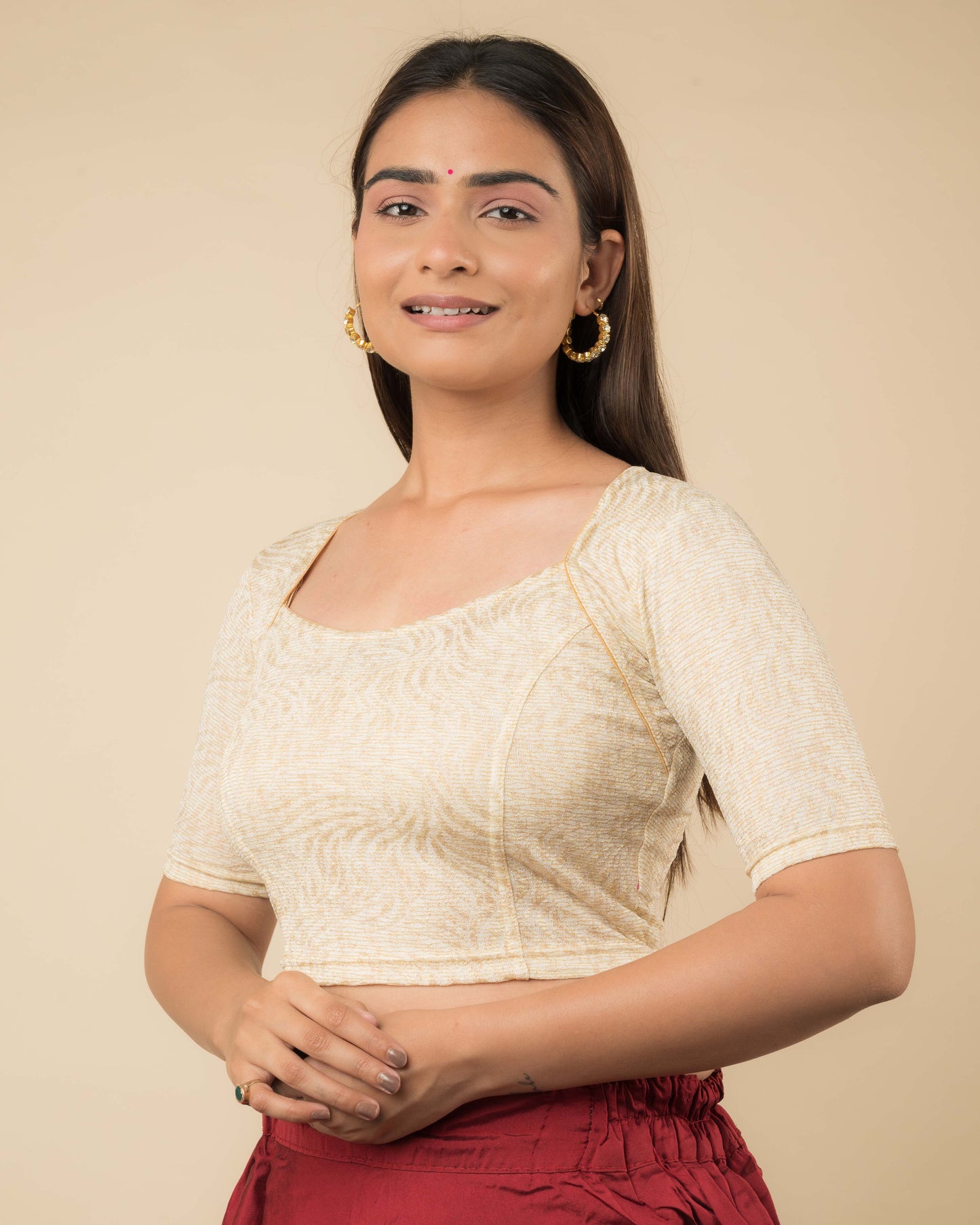 Side profile of the metallic floral stretchable blouse highlighting the fit and sleeve length.