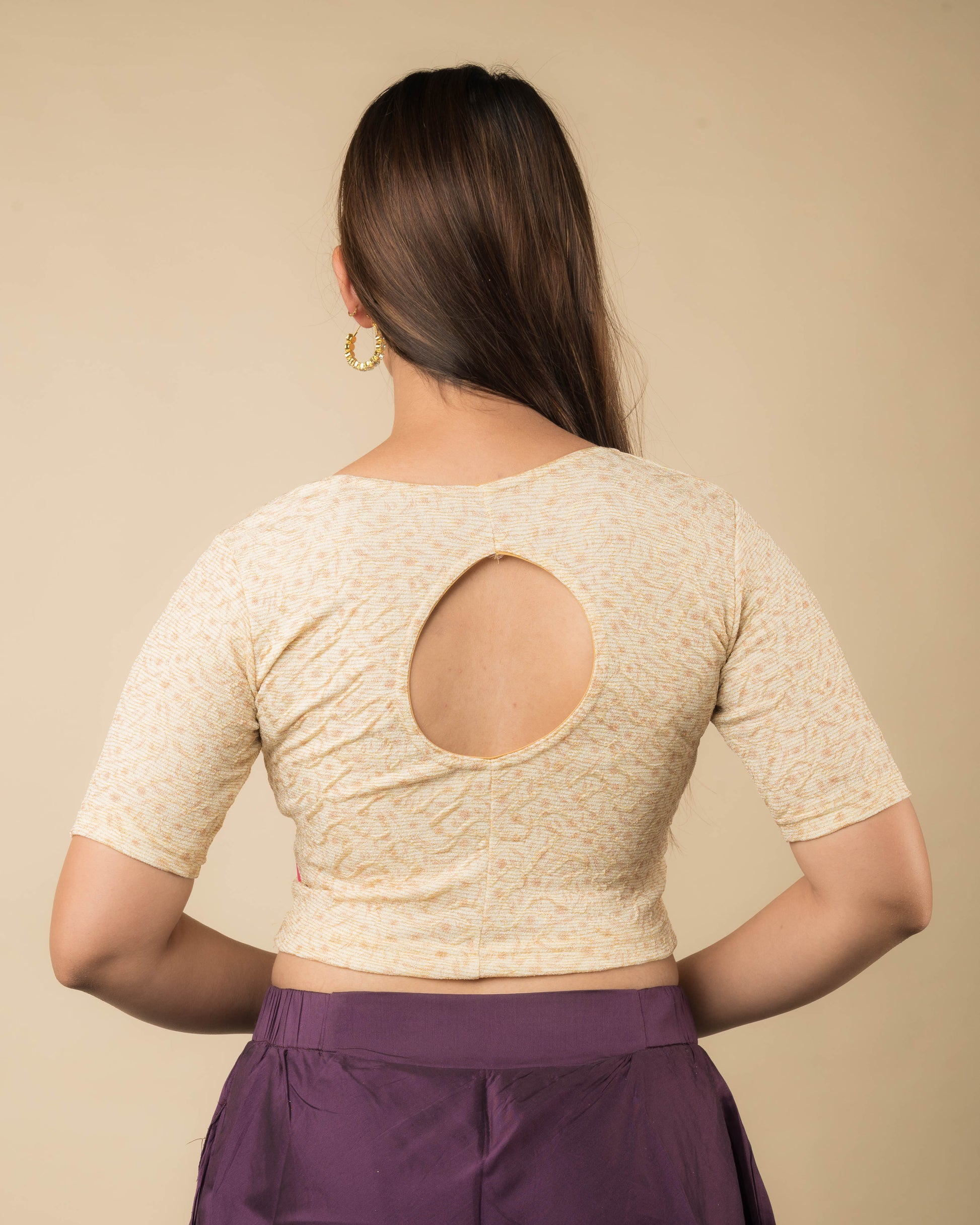 Rear view of the metallic floral stretchable blouse showcasing the back design