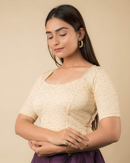 Side profile of the metallic floral stretchable blouse highlighting the fit and sleeve length.