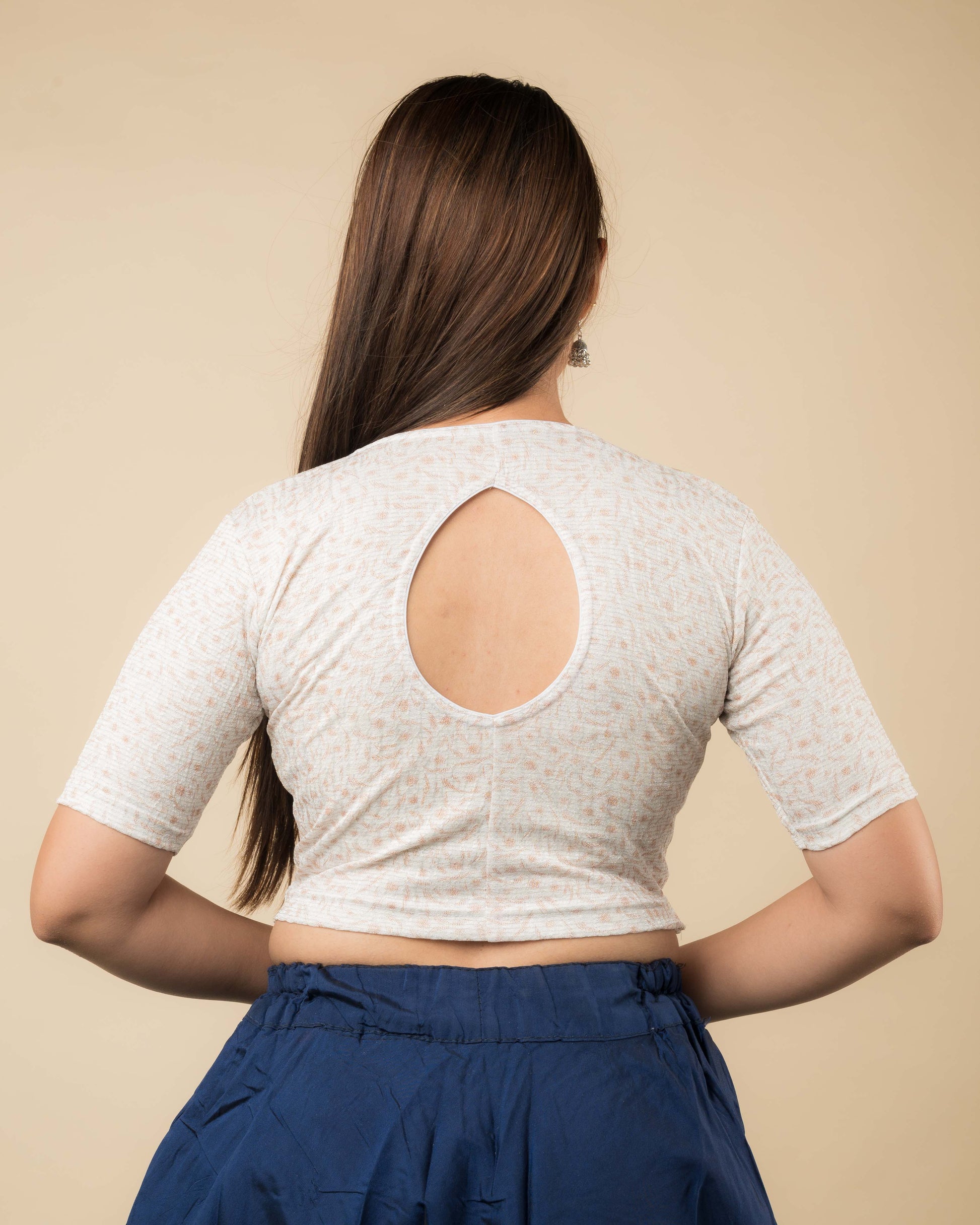 Rear view of the metallic floral stretchable blouse showcasing the back design.