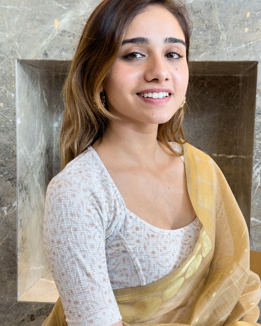 Model pairing the metallic floral stretchable blouse with a traditional saree, demonstrating a complete ethnic look.
