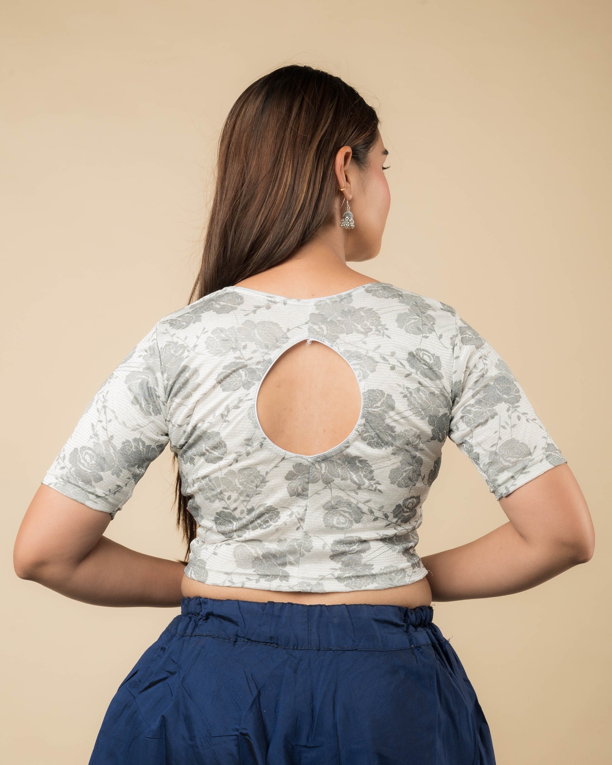 Rear view of the metallic floral stretchable blouse showcasing the peekaboo back design.