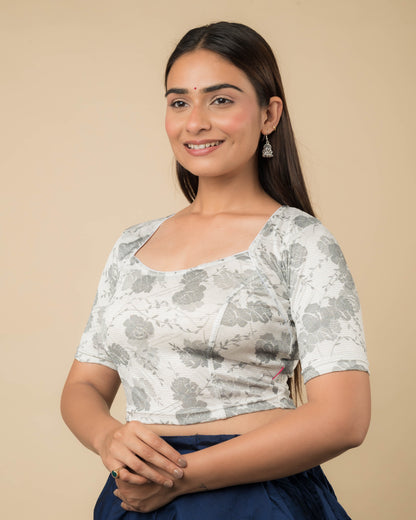 Side profile of the metallic floral stretchable blouse highlighting the fit and sleeve length.