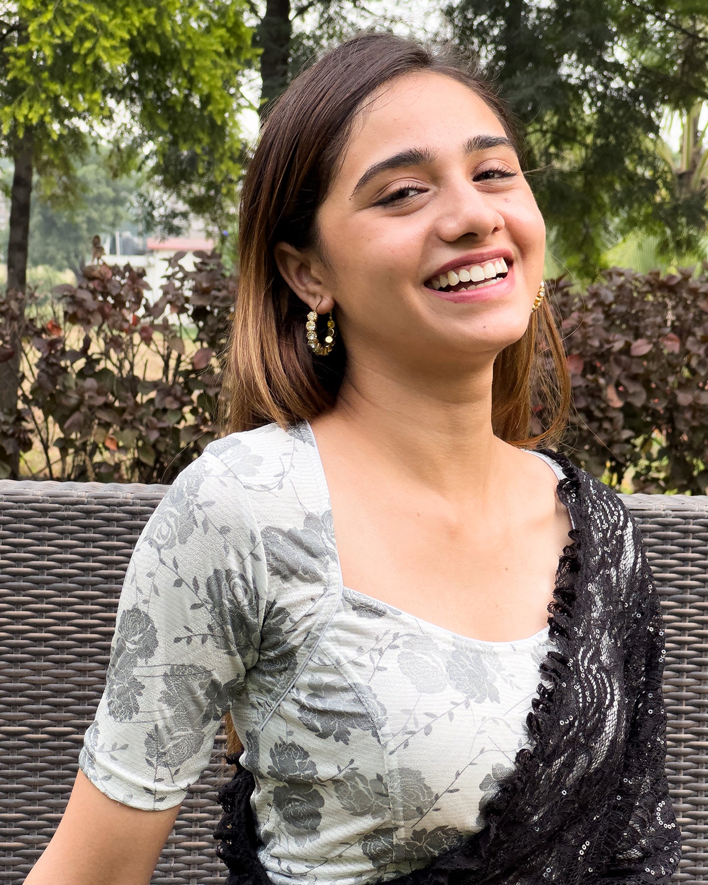 Model pairing the metallic floral stretchable blouse with a traditional saree, demonstrating a complete ethnic look.