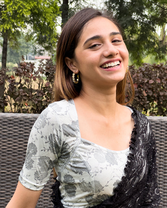 Model pairing the metallic floral stretchable blouse with a traditional saree, demonstrating a complete ethnic look.