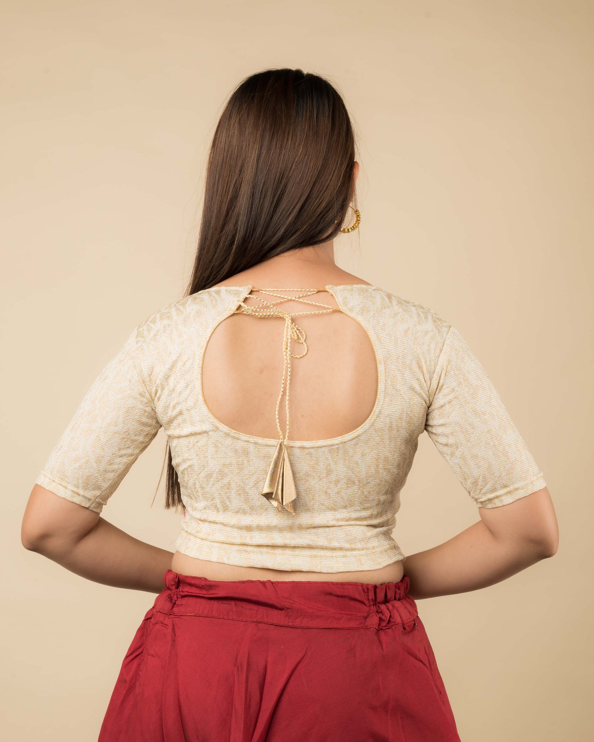 Rear view of the jacquard stretchable blouse showcasing the dori tie-up with tassels.
