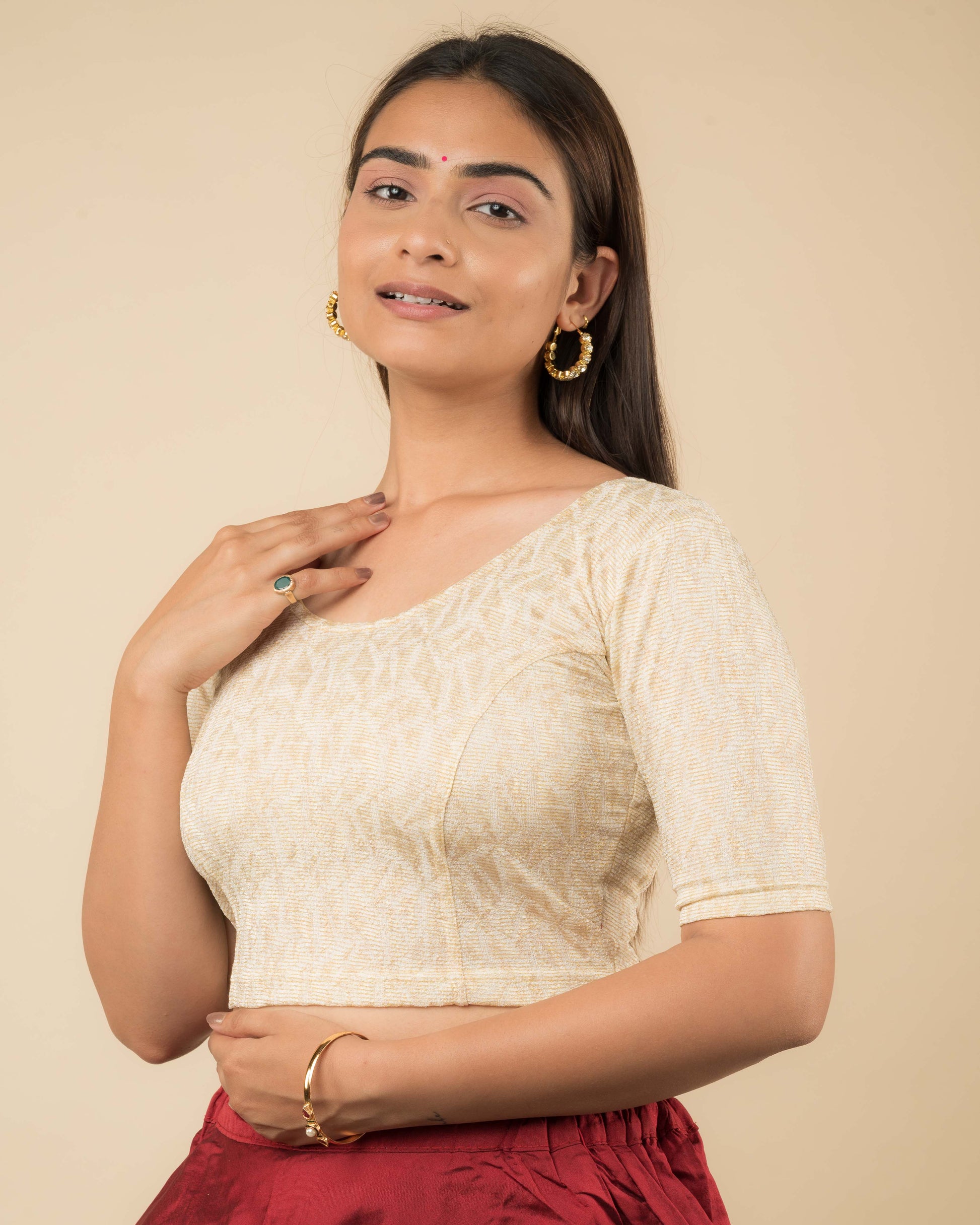Side profile of the jacquard stretchable blouse highlighting the fit and sleeve length.
