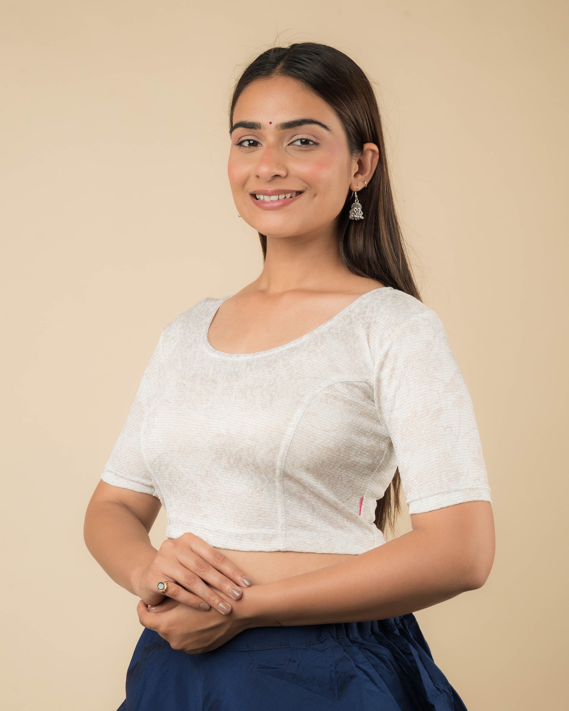 Side profile of the jacquard stretchable blouse highlighting the fit and sleeve length.