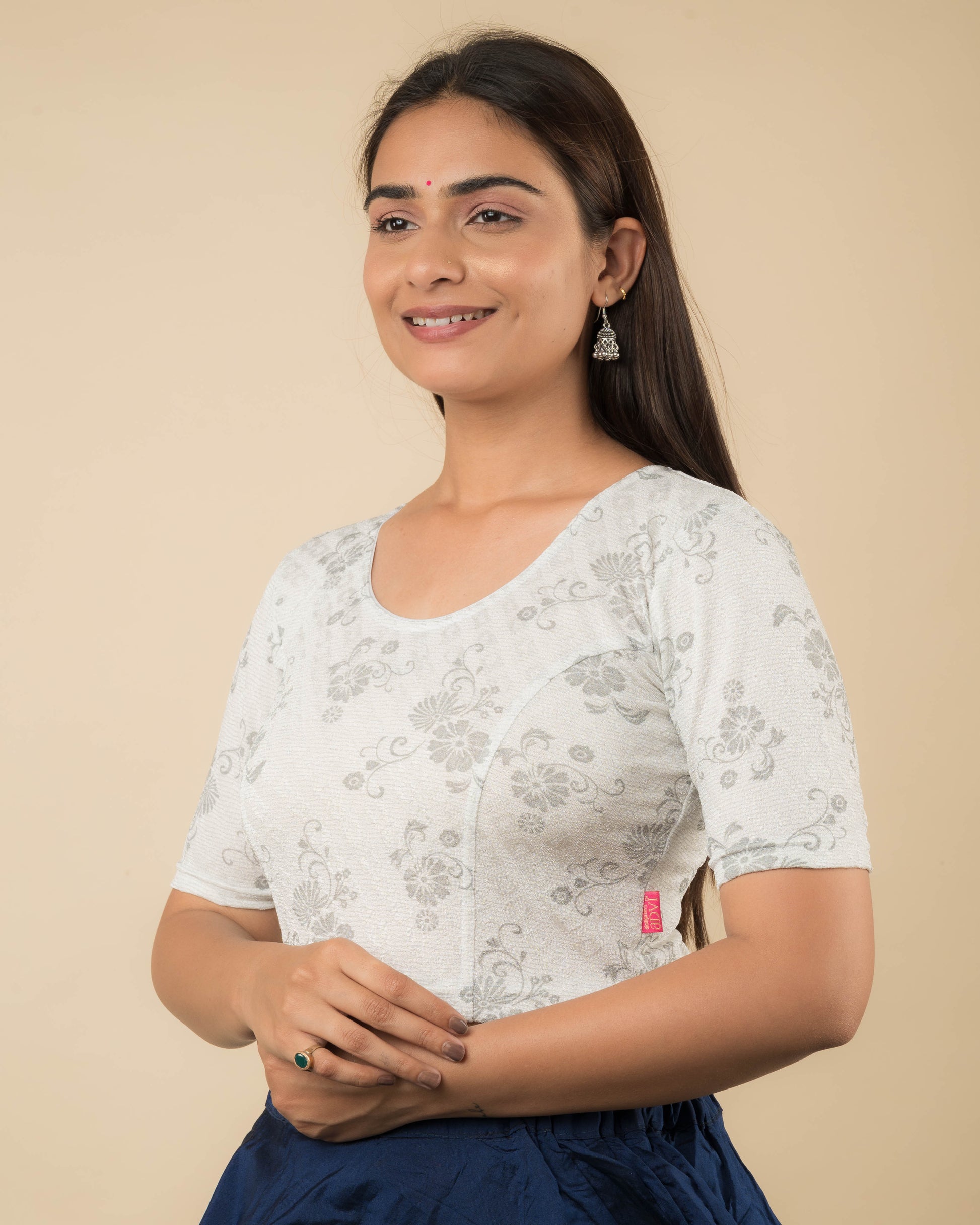 Side profile of the metallic floral stretchable blouse highlighting the fit and sleeve length.