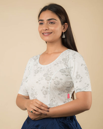 Side profile of the metallic floral stretchable blouse highlighting the fit and sleeve length.
