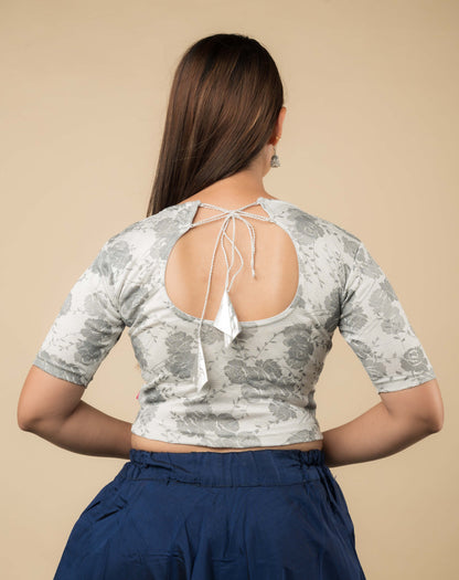 Rear view of the jacquard stretchable blouse showcasing the dori tie-up with tassels.