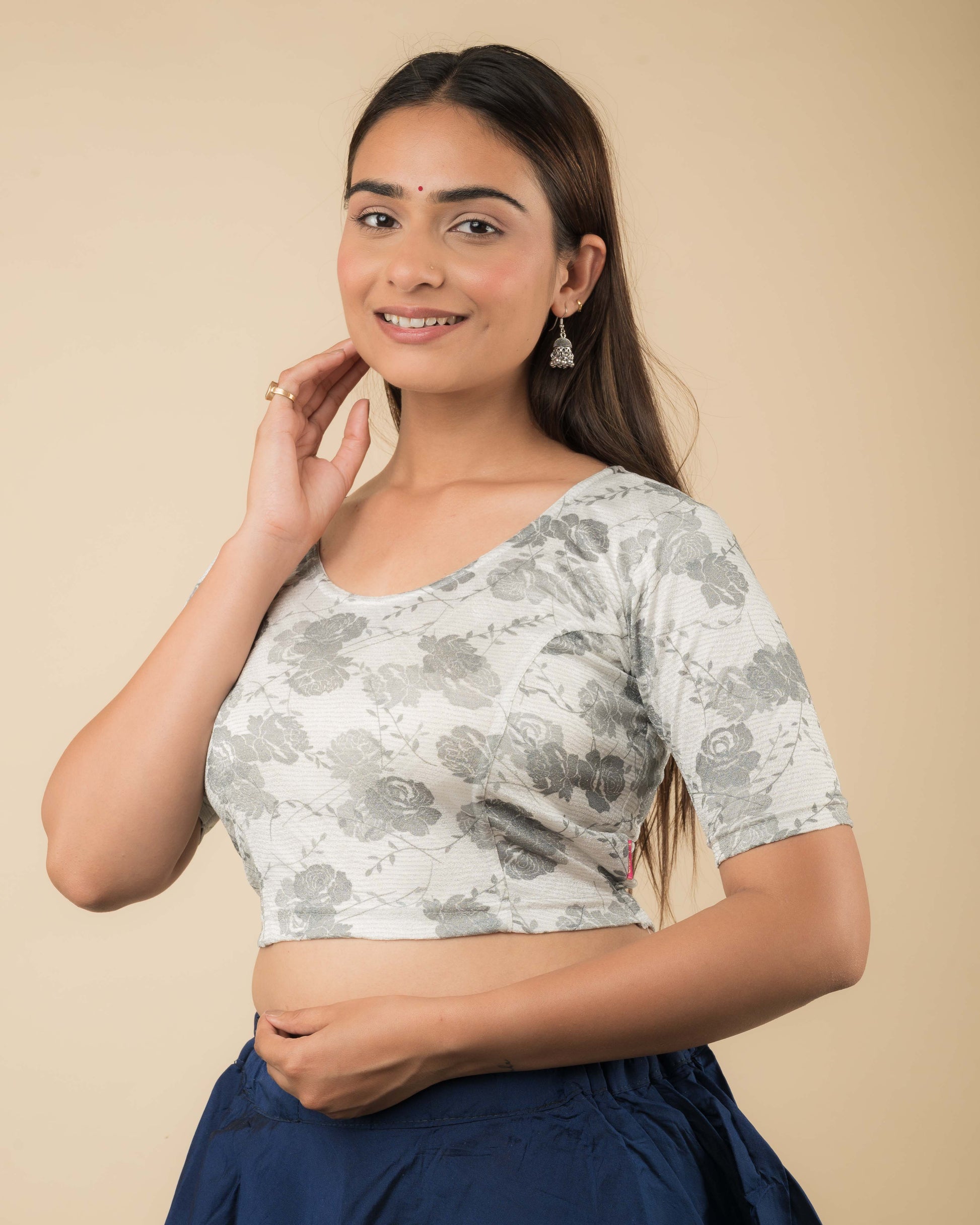 Side profile of the jacquard stretchable blouse highlighting the fit and sleeve length.