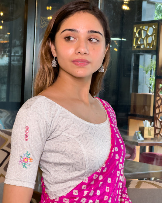Model pairing the mirror embellished knitted stretchable blouse with a traditional saree, demonstrating a complete ethnic look.